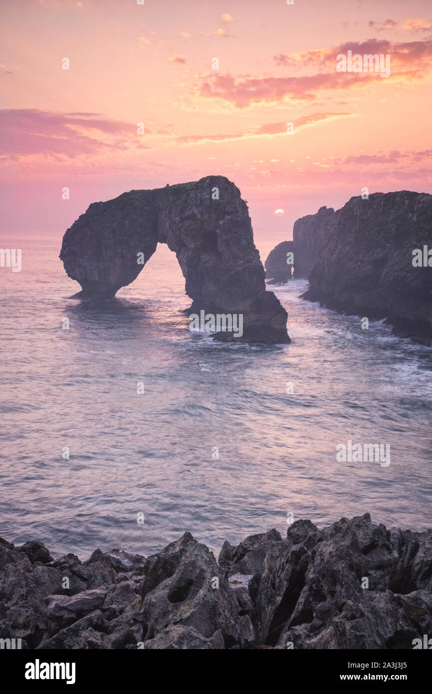 'Castro de las Gaviotas Rock' at sunrise Stock Photo