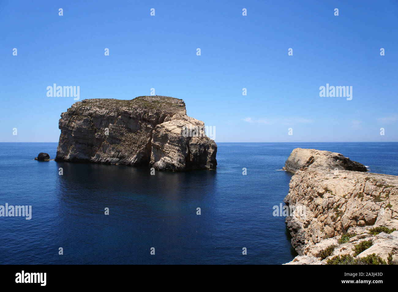 Fungus Rock and landscape of Dwejra Bay next to Azure Window (it-Tieqa Żerqa) in Xlendi, Gozo Stock Photo