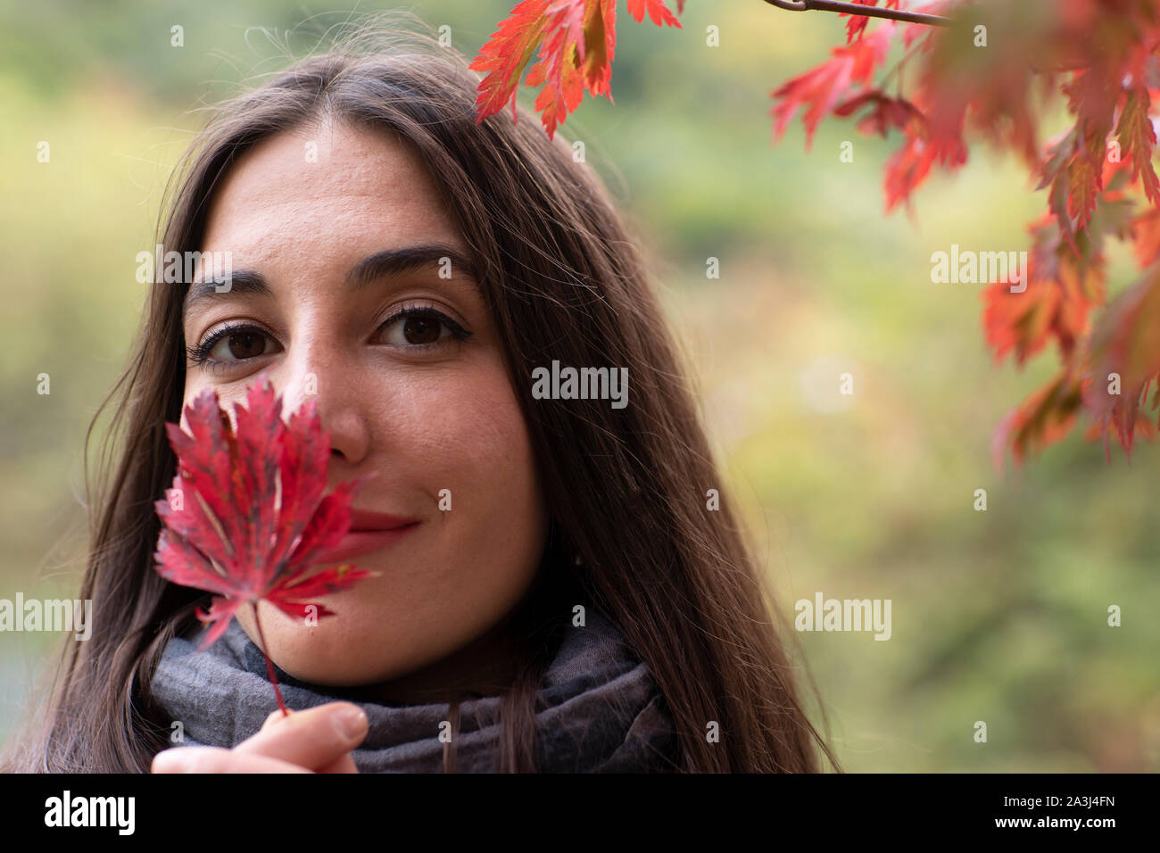 young woman with leaf in the hands Stock Photo