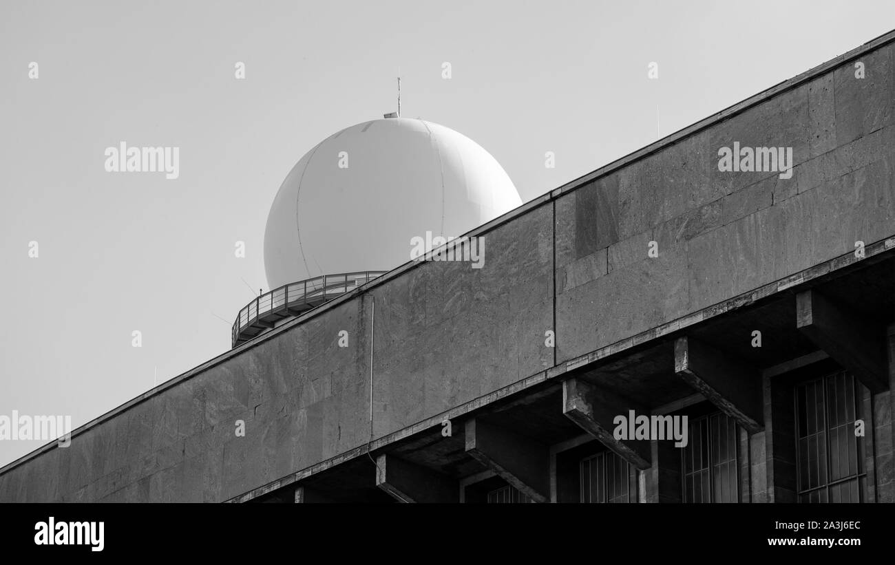 RRP 117 Radar Tower Behind A Terminal Building At Former Tempelhof Airport In Berlin, Germany, Black And White Stock Photo
