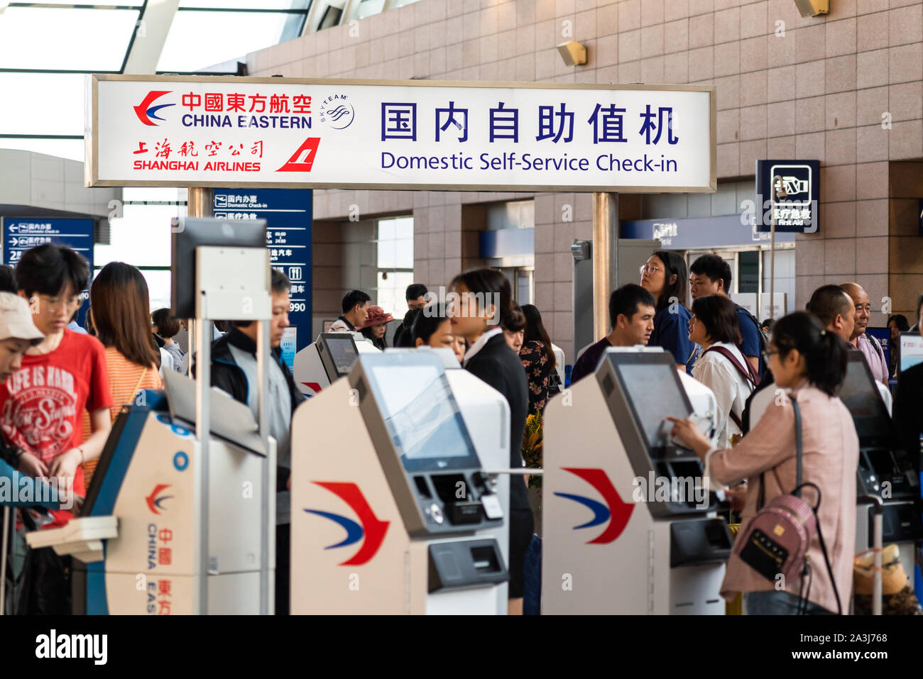 Passengers use the China Eastern Airlines kiosks for domestic selfservice checkin in Shanghai