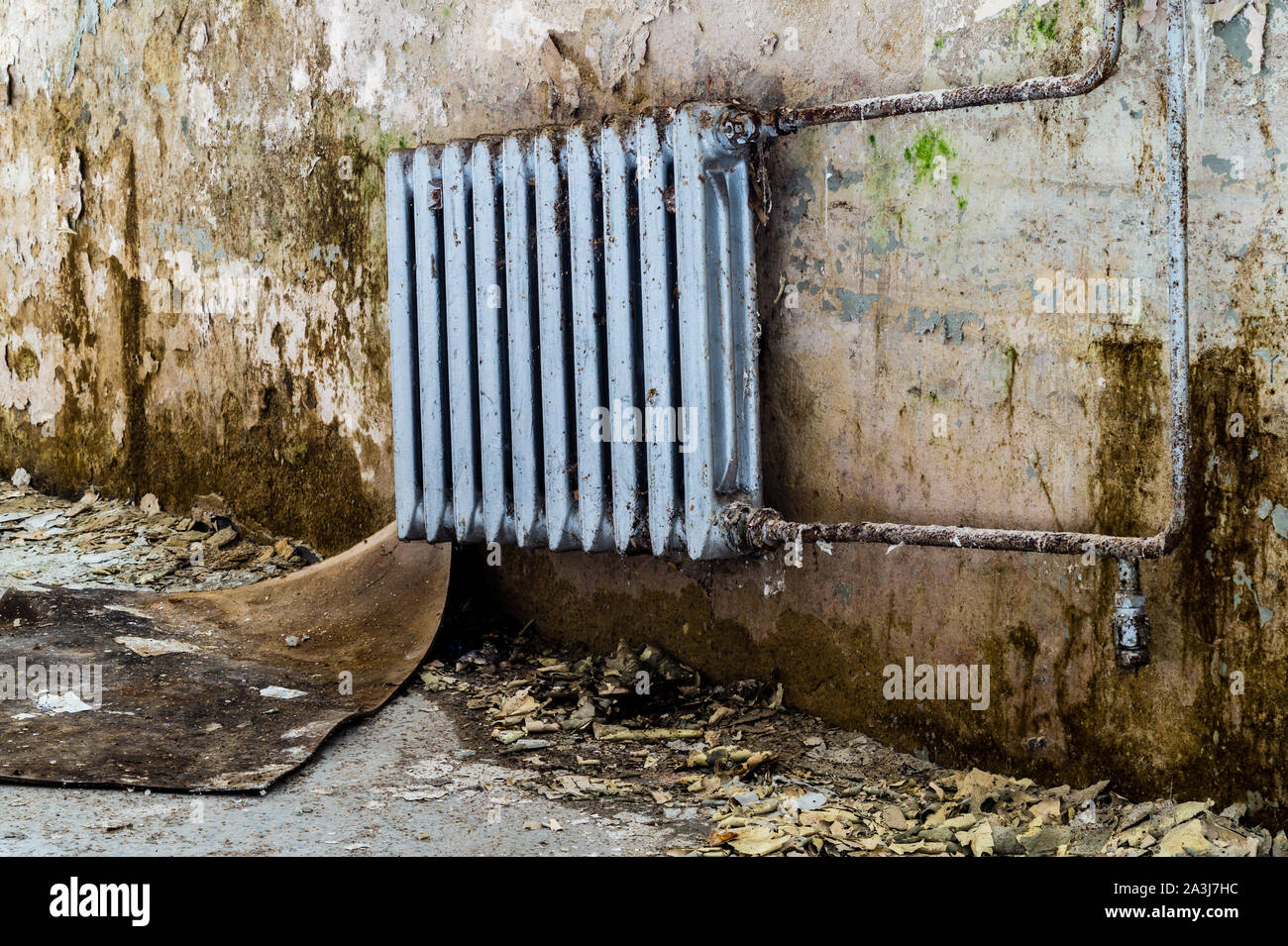Old heating after water damage in the room Stock Photo