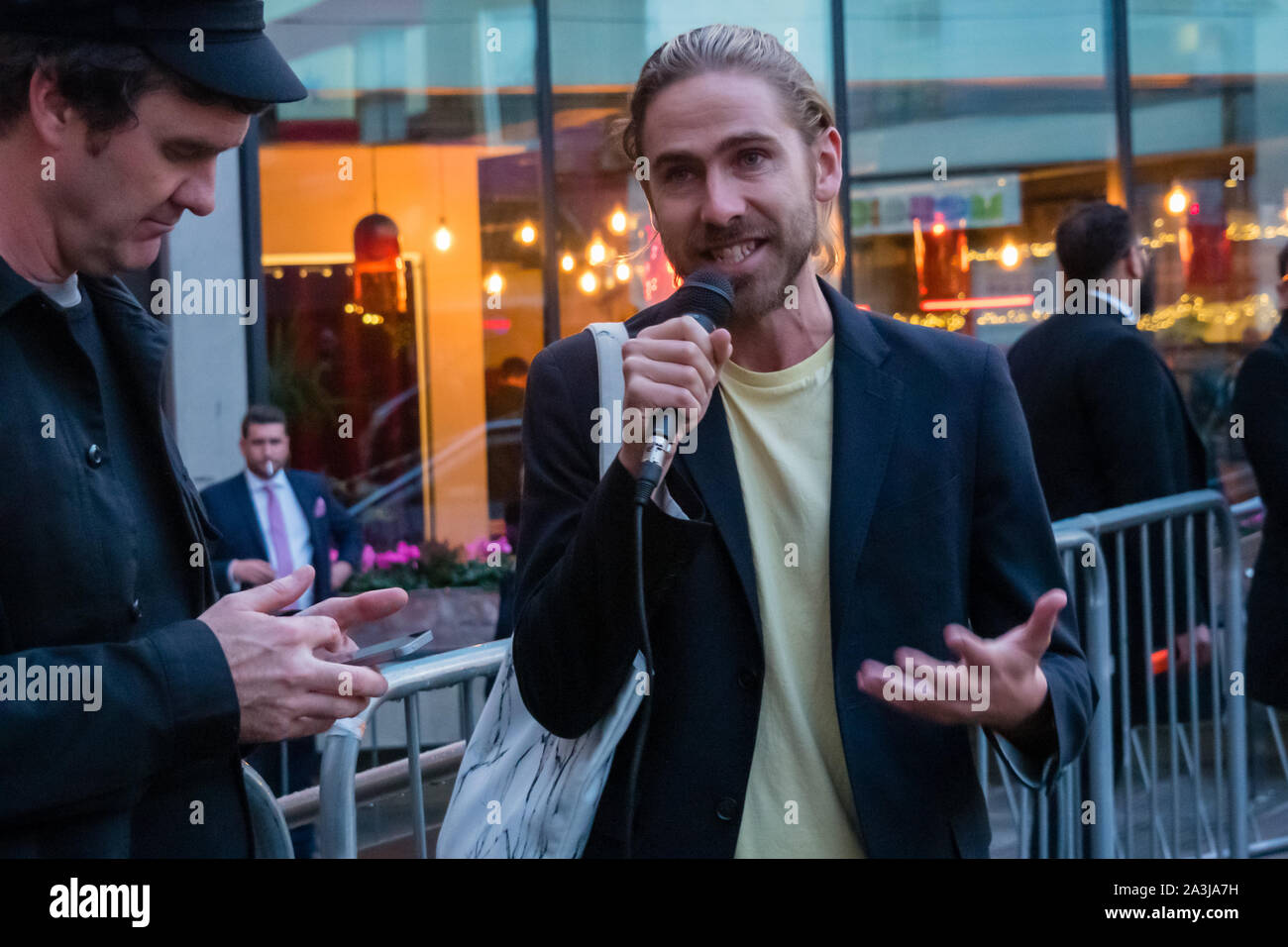 London, UK. 8th October 2019. Oliver Wainwright, the Guardian's  architecture and design critic came to talk to the ASH protesters on his  way into the awards and spoke briefly at the protest.