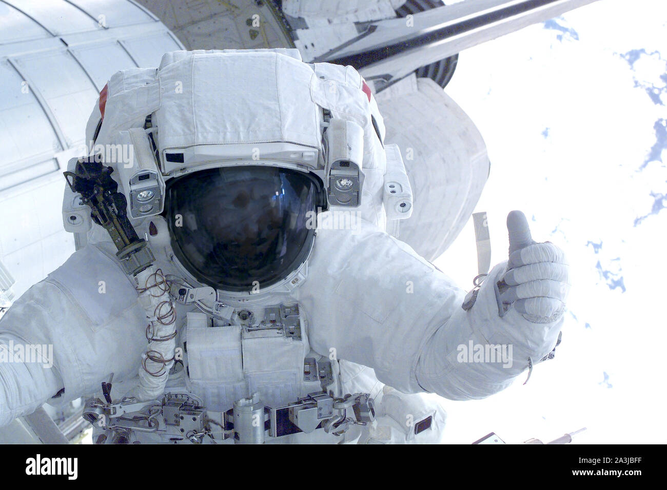 Astronaut on a space station showing thumbs up. Elements of this image were  furnished by NASA Stock Photo - Alamy