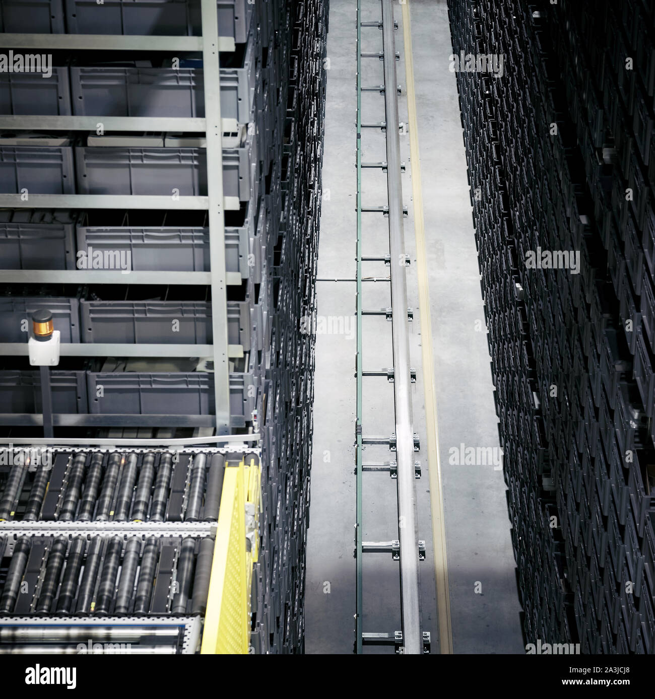 Automated warehouse transport system, focus on the rail. Stock Photo