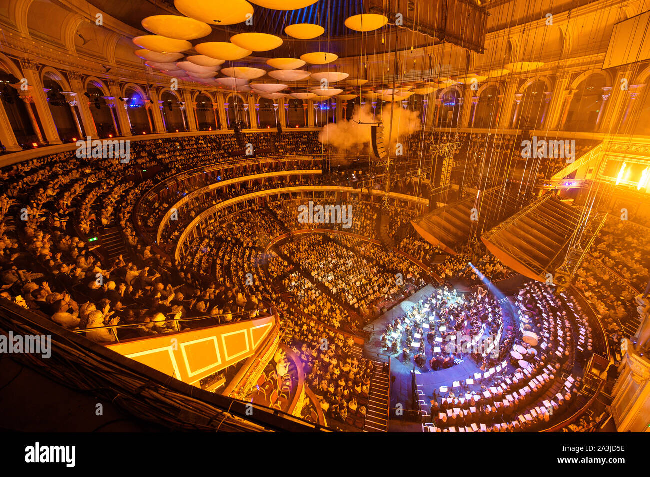 Pyrotechnics during the grand finale of the final performance lead by Stephen Barlow conducting the Bournemouth Sympathy Orchestra and Chorus during a performance of 1812 Overture by Tchaikovsky at Classic FM Live at London's Royal Albert Hall. Stock Photo
