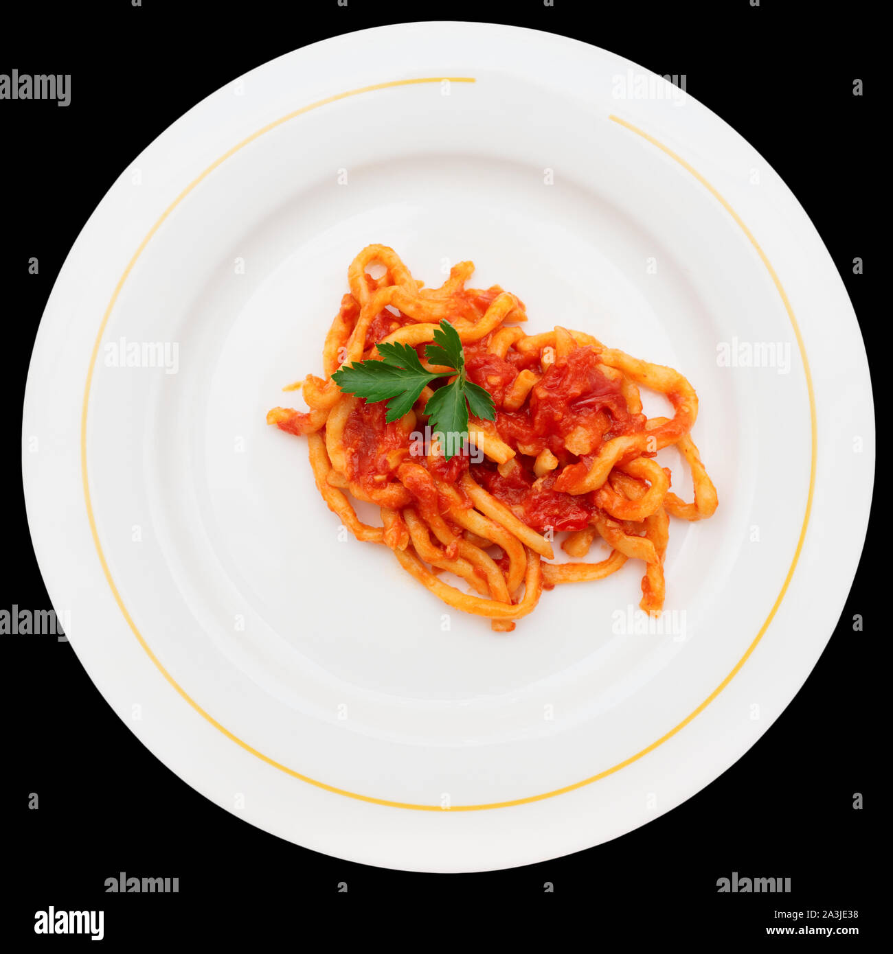 Pinci Traditional Tuscan pici pasta with tomato sauce, isolated on white ...