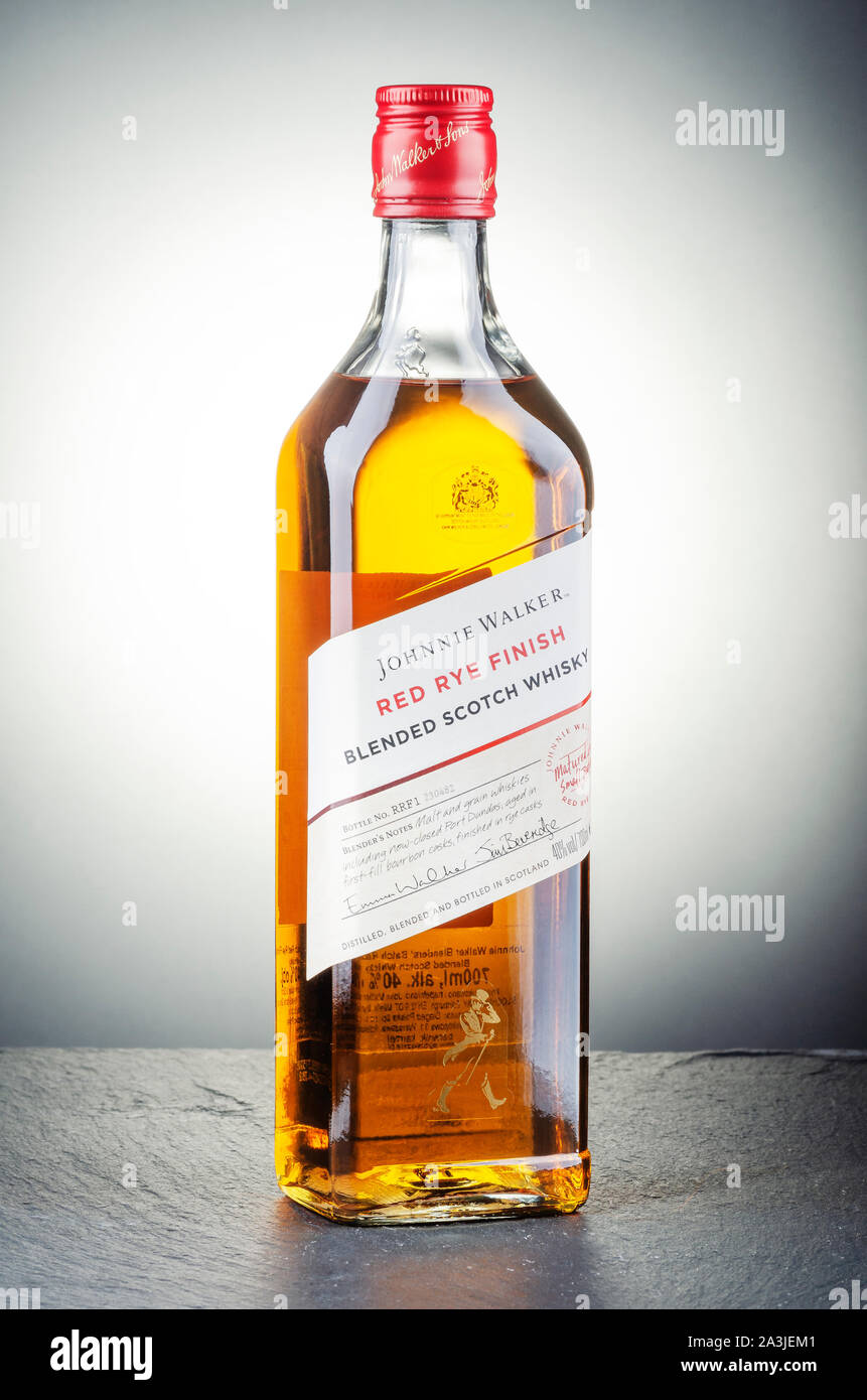 Johnnie Walker red rye finish blended whisky on gradient background. Johnnie  Walker was established in 1820 in Kilmarnock, Scotland Stock Photo - Alamy