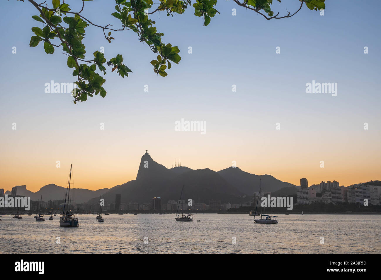 Rio de Janeiro, Brazil - October 3, 2019: beautiful sunset of Rio de Janeiro, with clear sky, mountain skyline, seen from the Mureta da Urca Stock Photo