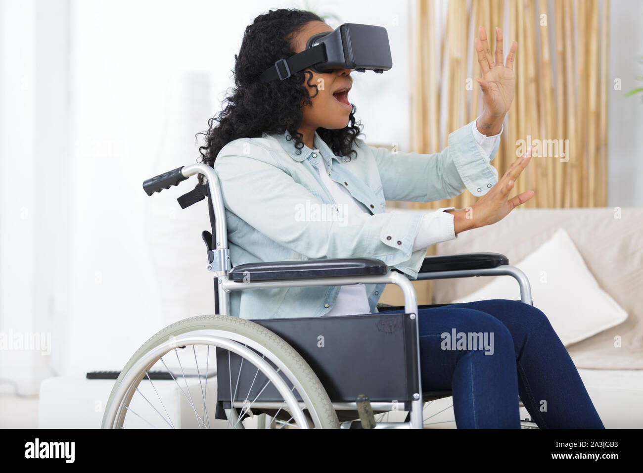 woman in wheelchair and vr goggles in the office Stock Photo - Alamy