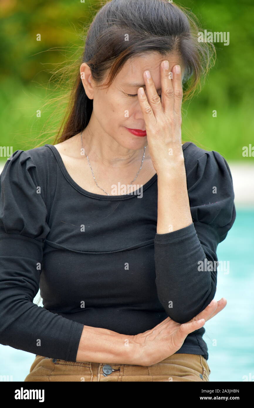 A Sad Senior Diverse Person Stock Photo