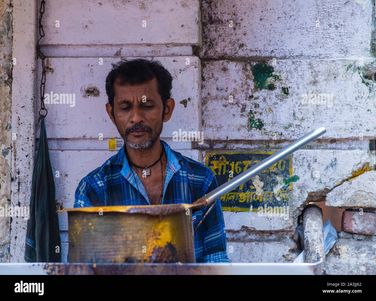 Indian man in Dharavi neighbourhood in Mumbai , India Stock Photo