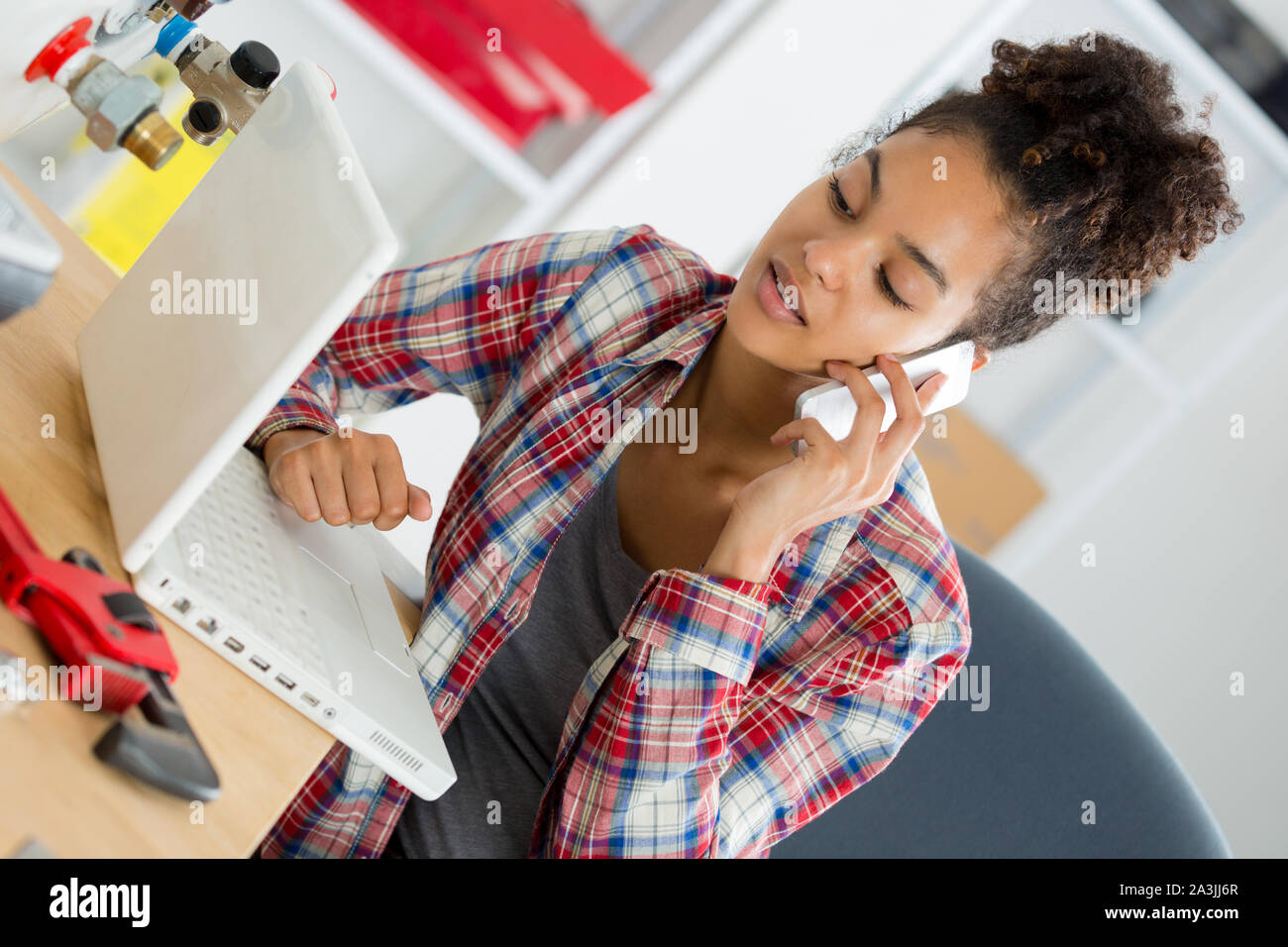 operator woman phone laptop computer Stock Photo - Alamy