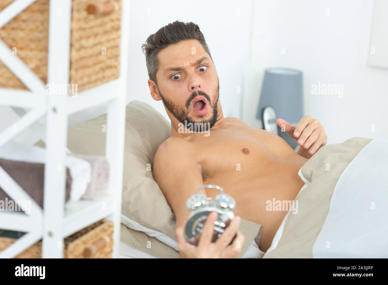 man-waking-up-late-in-the-morning-stock-photo-alamy