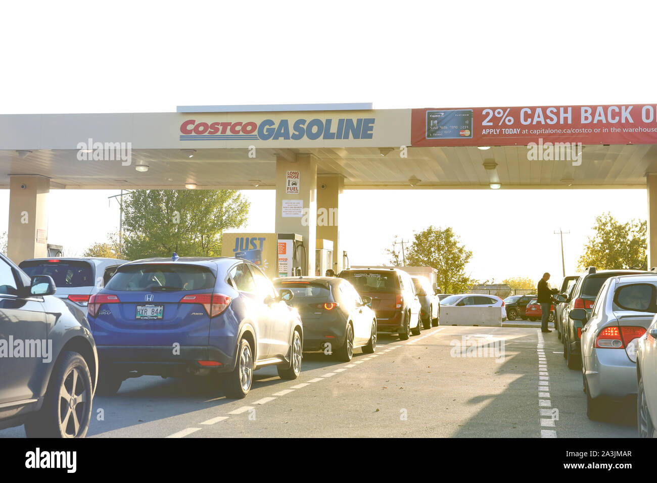 Winnipeg, Manitoba / Canada - October 7, 2019: Cars Line at Costco Gas Station. Stock Photo