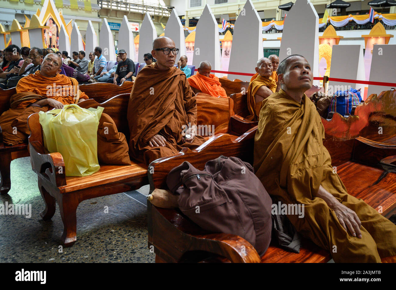 Buddhist monks seated their own exclusive area in Hua Lamphong Station, Bangkok, Thailand Stock Photo