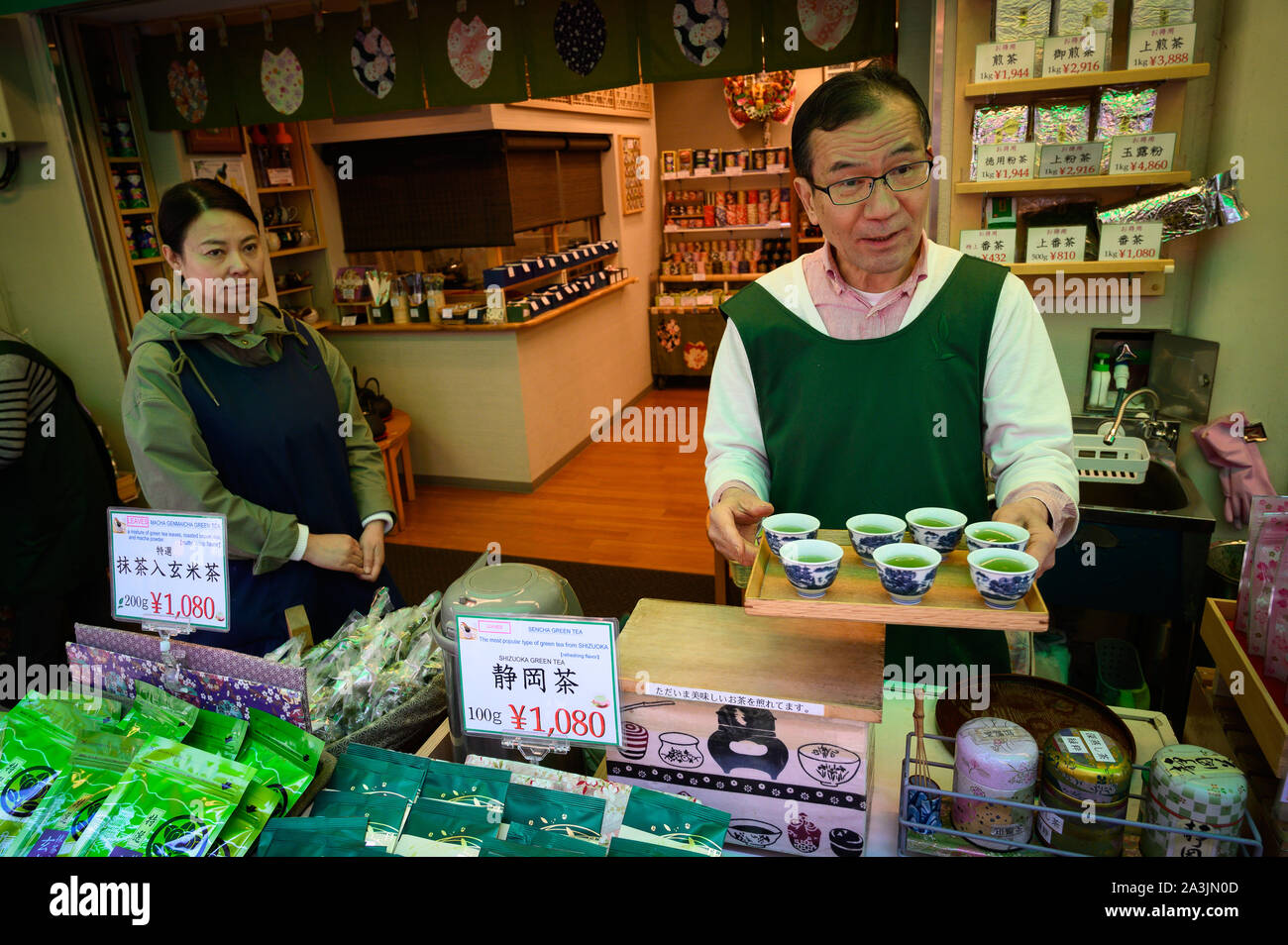 Vendors of green tea giving out samples at their shop in Ameyoko Market