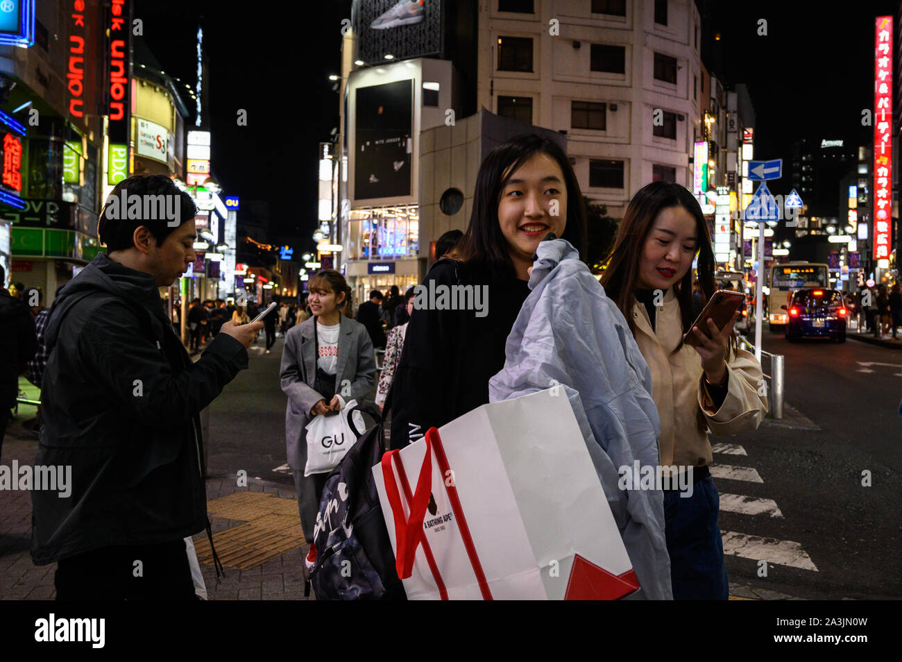 Young women on the street for a Saturday night in Shibuya Center Gai, Tokyo, Japan Stock Photo