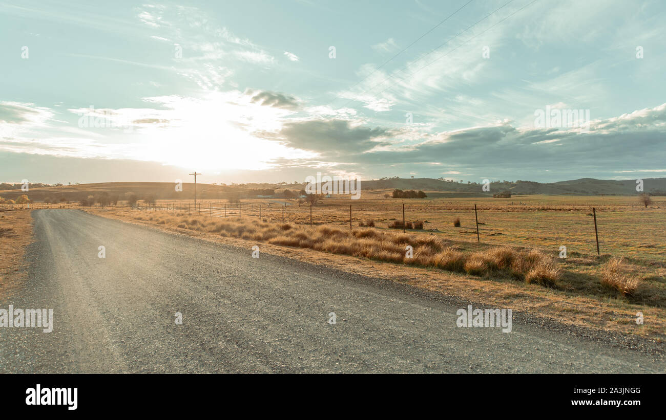 Bright Sun In The Background Shining On The Road Stock Photo Alamy