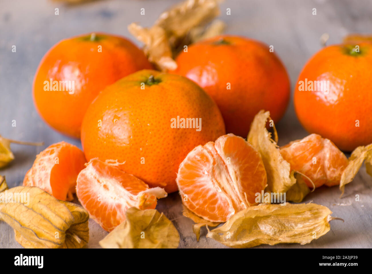 tangerine and dried leaf Stock Photo