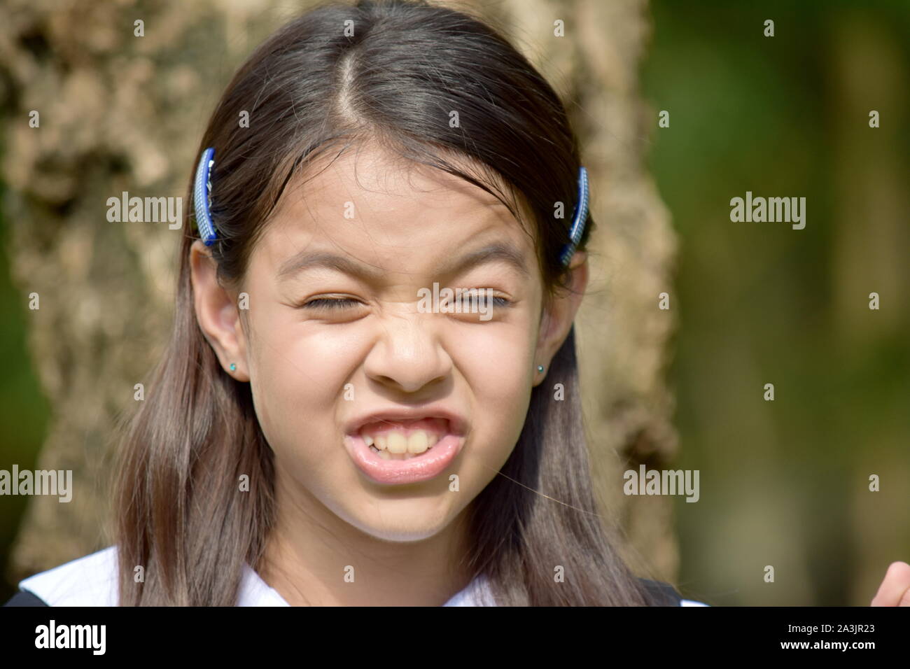 Upset Female Student Wearing School Uniform Stock Photo