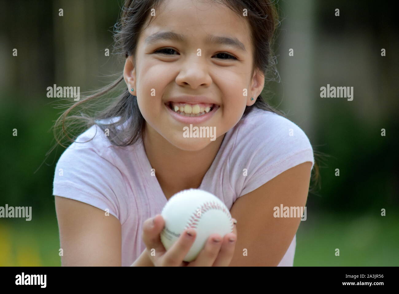 Happy Female Baseball Player Child Athlete With Baseball Stock Photo Alamy