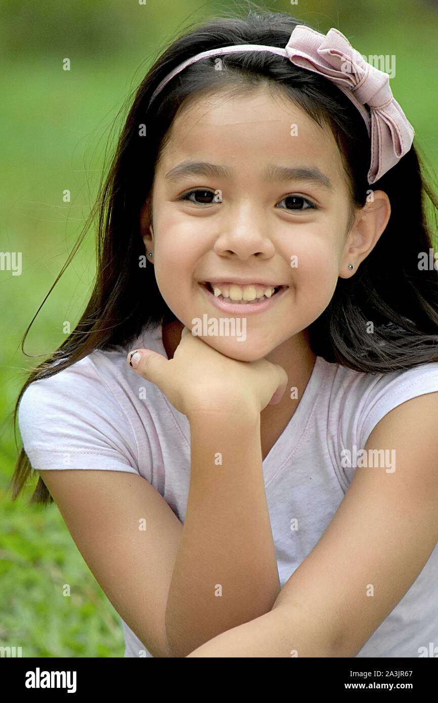 A Petite Asian Girl Smiling Stock Photo