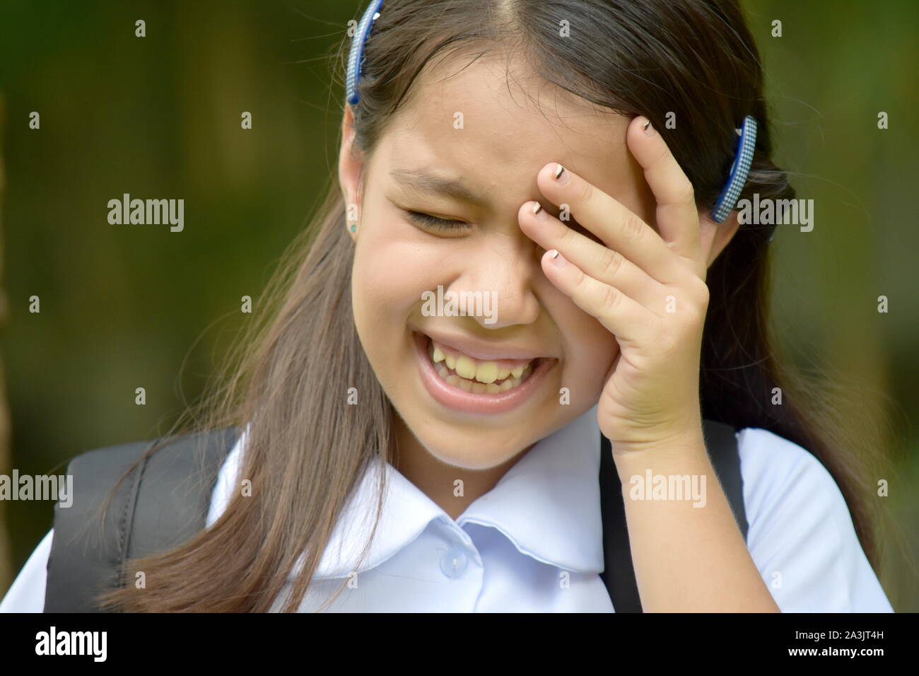 Crying Young Asian Girl Student With Books Stock Photo