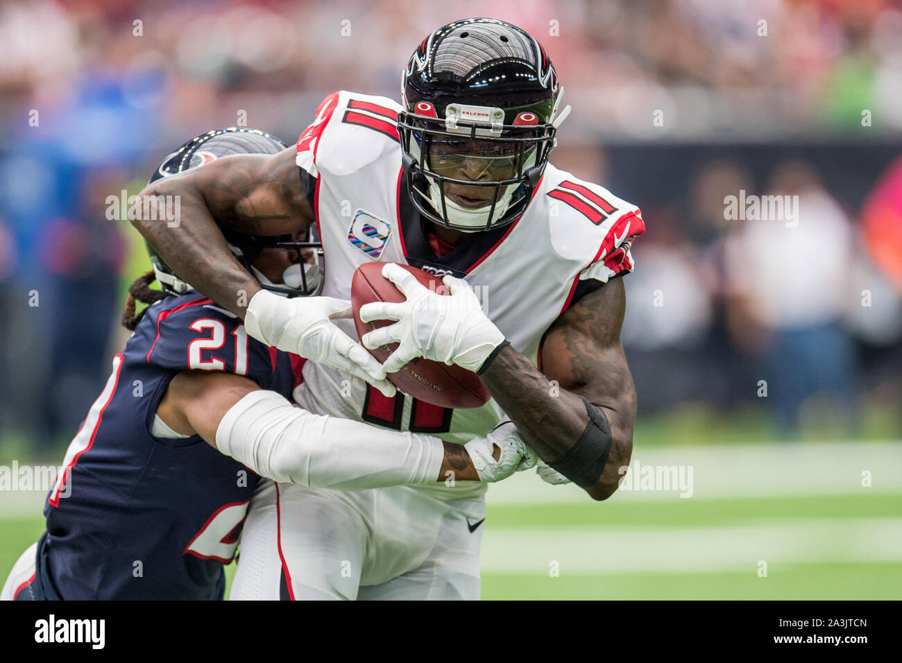 Houston, TX, USA. 6th Oct, 2019. Atlanta Falcons wide receiver Julio Jones (11) is tackled by Houston Texans cornerback Bradley Roby (21) during the 1st quarter of an NFL football game between the Houston Texans and the Atlanta Falcons at NRG Stadium in Houston, TX. The Texans won the game 53 to 32.Trask Smith/CSM/Alamy Live News Stock Photo