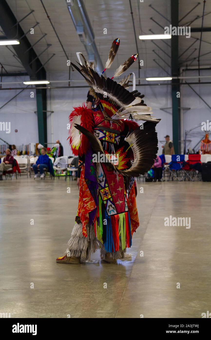 Native American dancer dressed in full regalia at a Pow Wow where ...