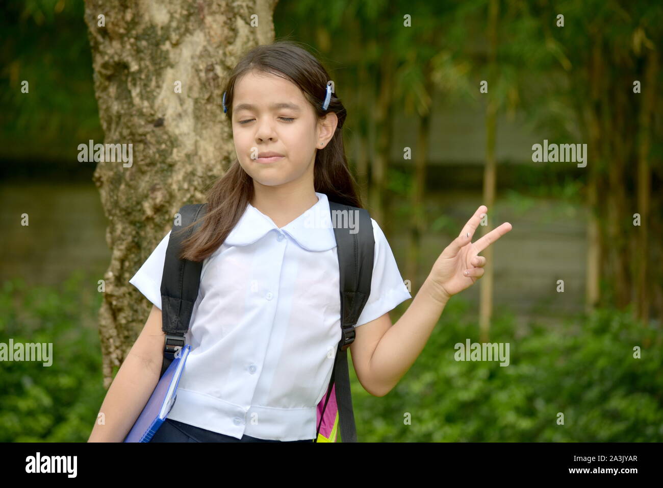 Girl Student And Peace Sign With Notebooks Stock Photo - Alamy