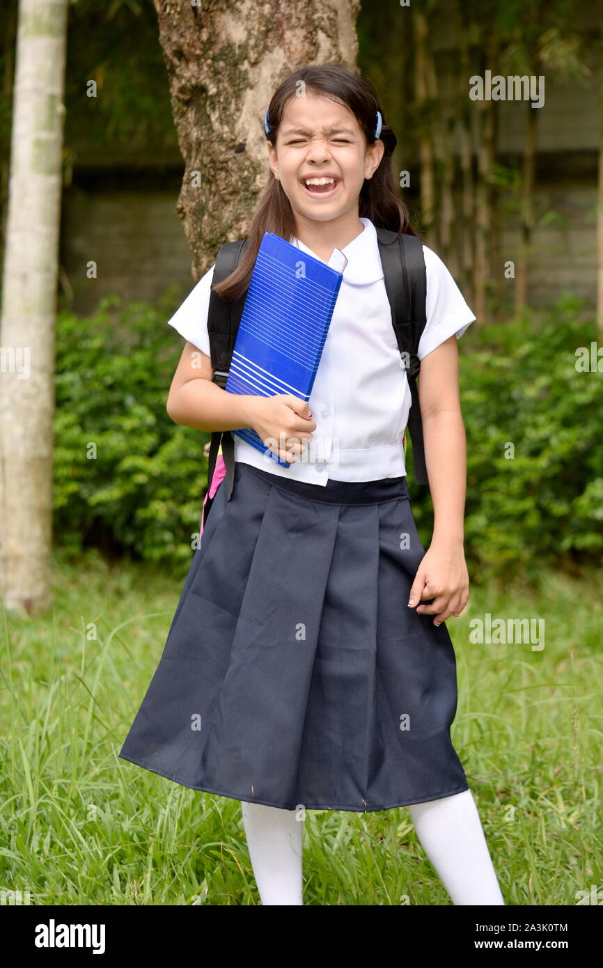Young Asian Girl Student Under Stress Wearing Uniform With Notebooks Stock  Photo - Alamy