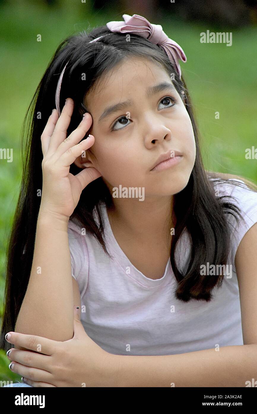 A Young Minority Female Deciding Stock Photo