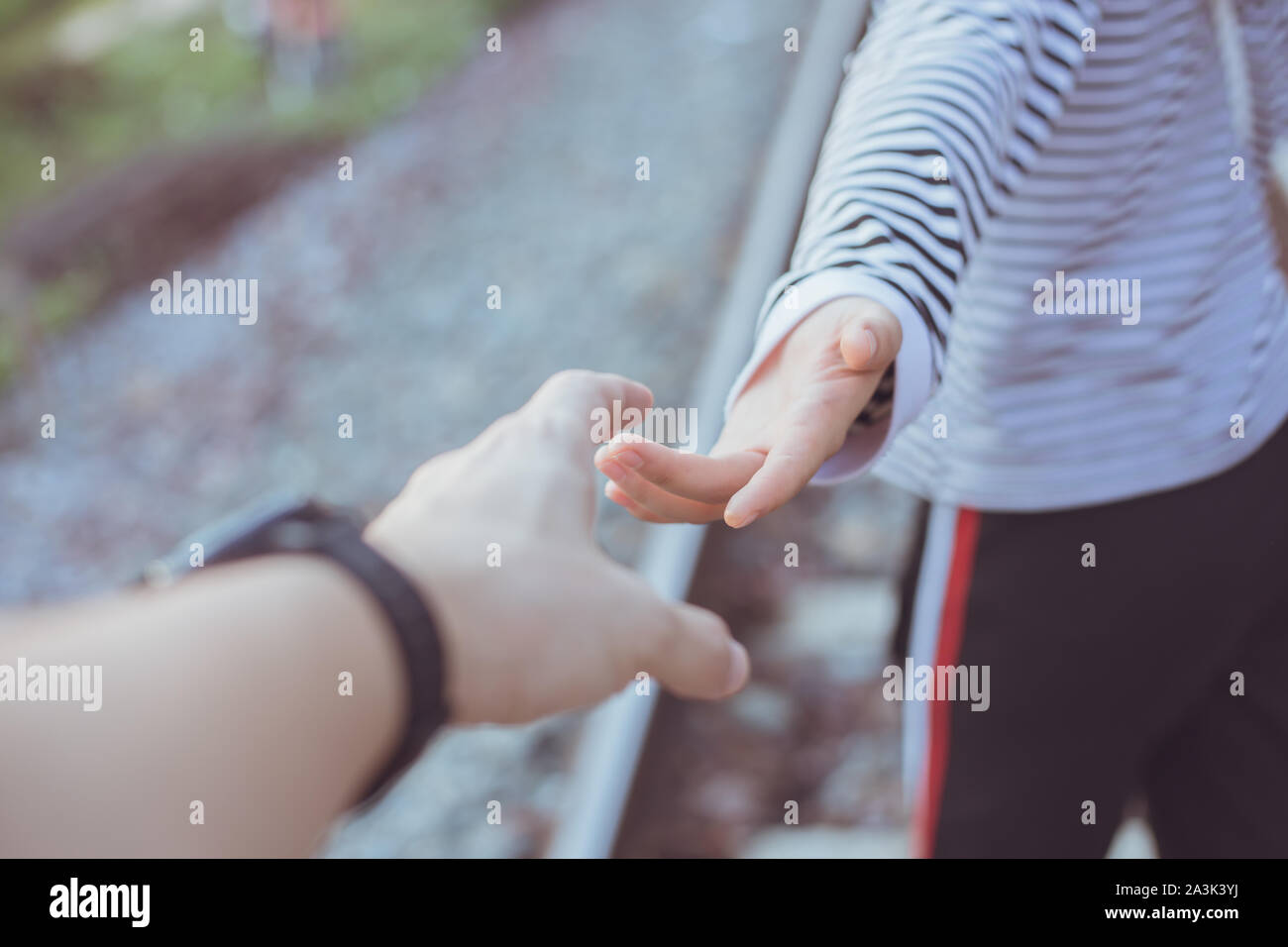 Girl teen reach her hand. Help Touch Care Support be a Good Friend with Love concept. Stock Photo