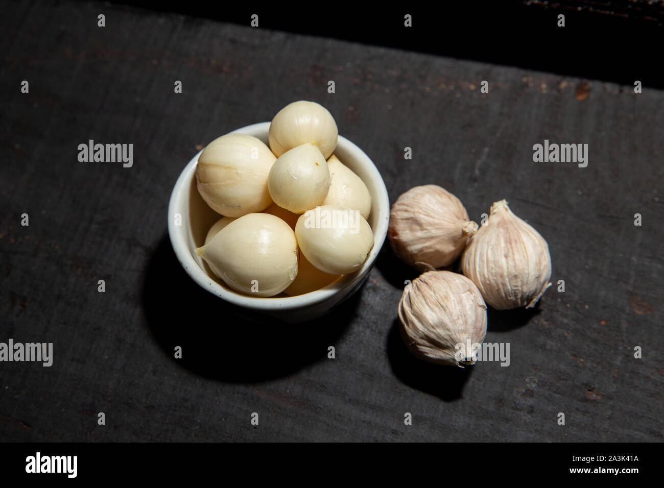Elephant Garlic Single Bulb form healthy herb aroma food ingredient on black wood background Stock Photo