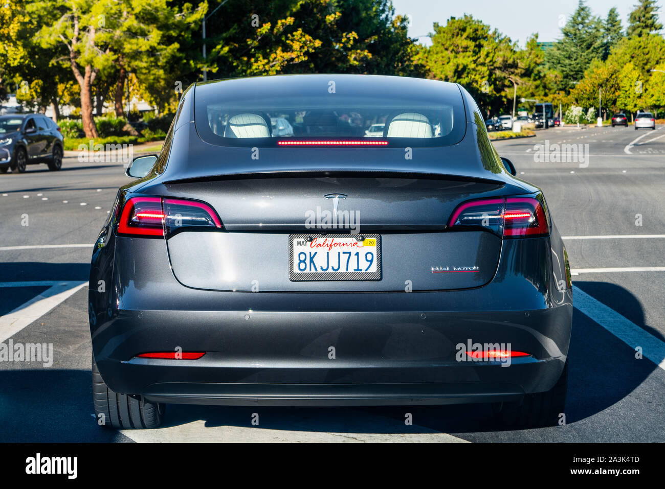 Sep 23, 2019 Sunnyvale / CA / USA - Tesla Model 3 stopped at a traffic light Stock Photo