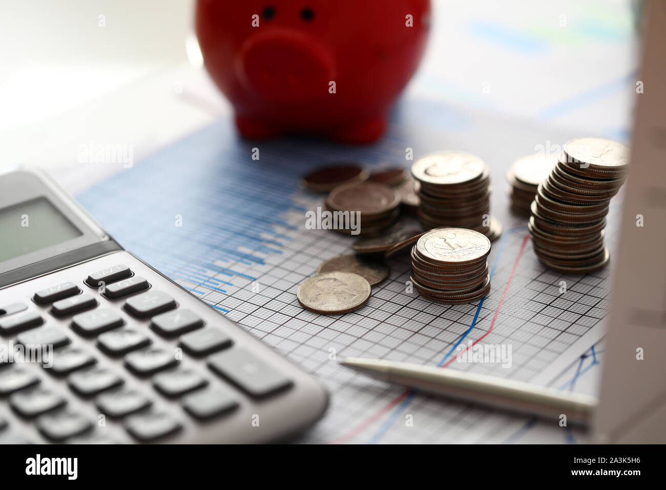 Coins piggy bank calculator hi-res stock photography and images - Alamy