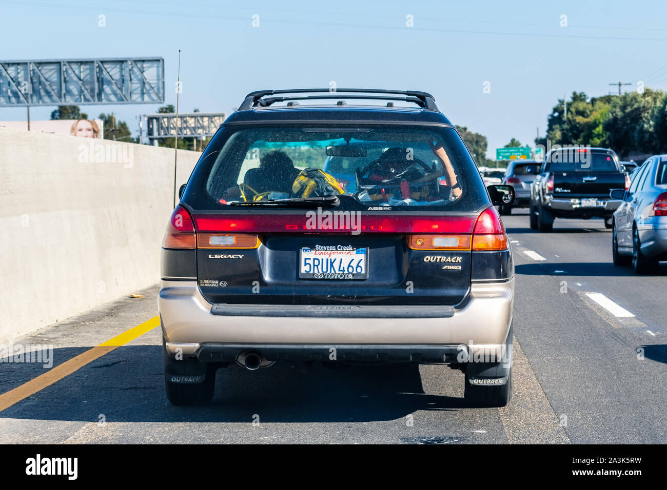 Sep 26, 2019 Mountain View / CA / USA - Subaru Outback driving on the freeway; Rear view of the first generation of Subaru Outback (1996), a variant o Stock Photo