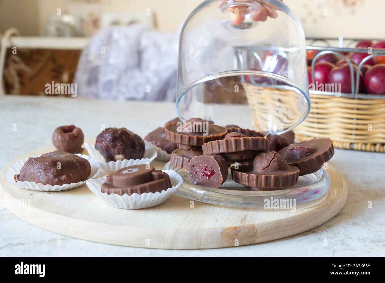 Homemade raw chocolate sweet candies with raspberries inside. Stock Photo