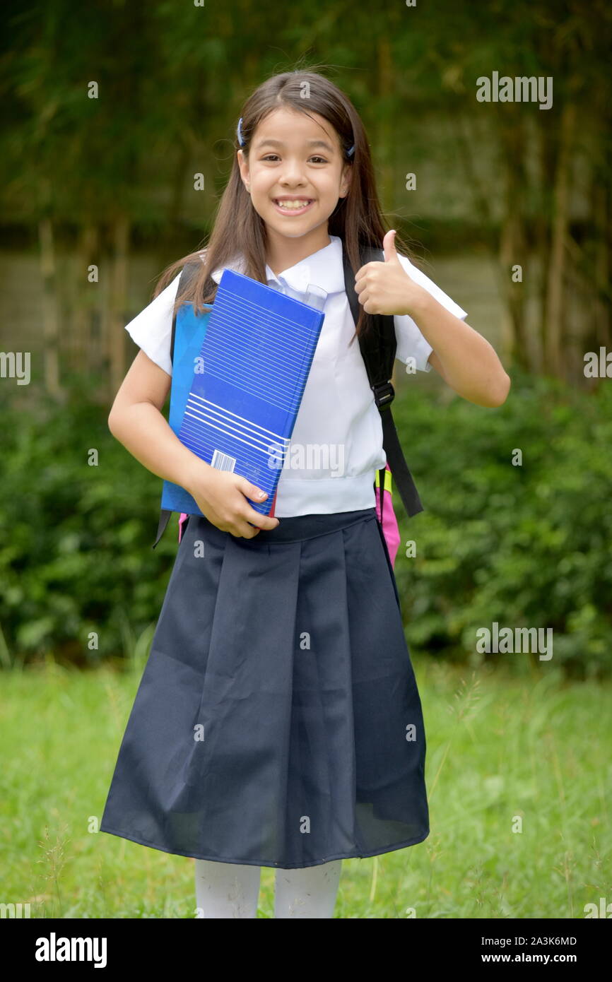 Minority Girl Student With Thumbs Up Wearing School Uniform With ...