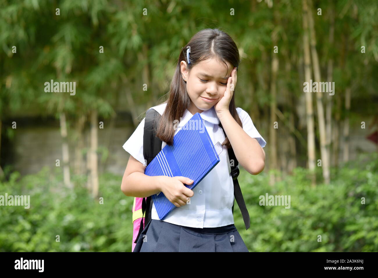 Depressed Catholic Minority School Girl Wearing Uniform Stock Photo