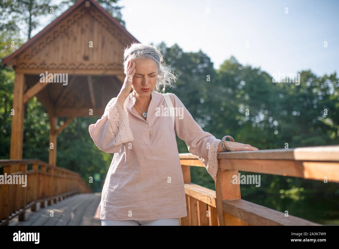 Mature woman alone walking park hi-res stock photography and images - Alamy