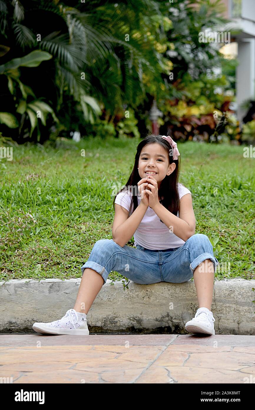Young Filipina Tween Praying Stock Photo