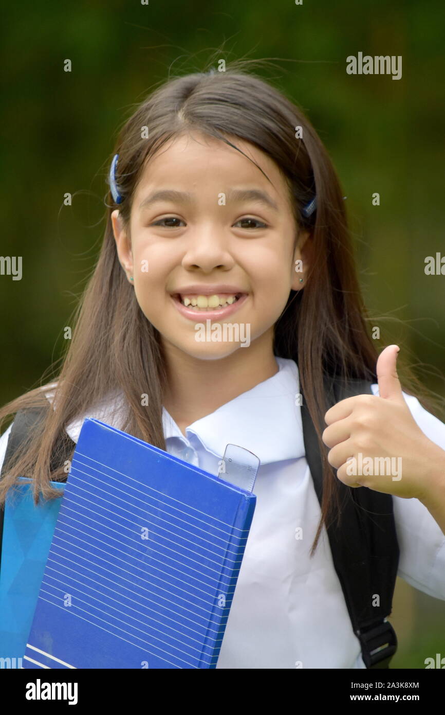 Female Student With Thumbs Up Stock Photo - Alamy