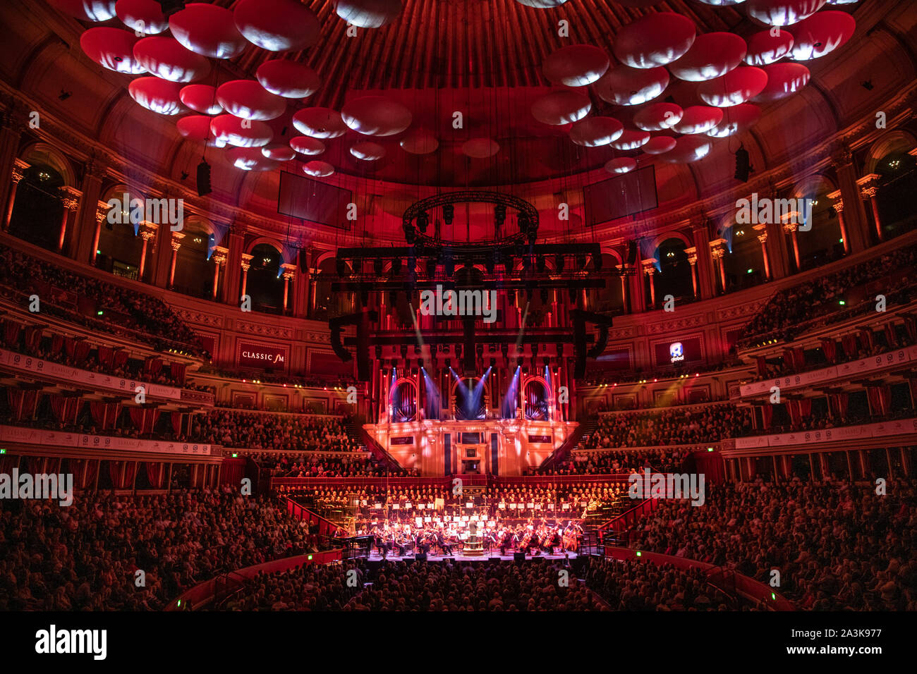 Stephen Barlow conducting the Bournemouth Sympathy Orchestra and Chorus during a performance of 1812 Overture by Tchaikovsky at Classic FM Live at London's Royal Albert Hall. Stock Photo