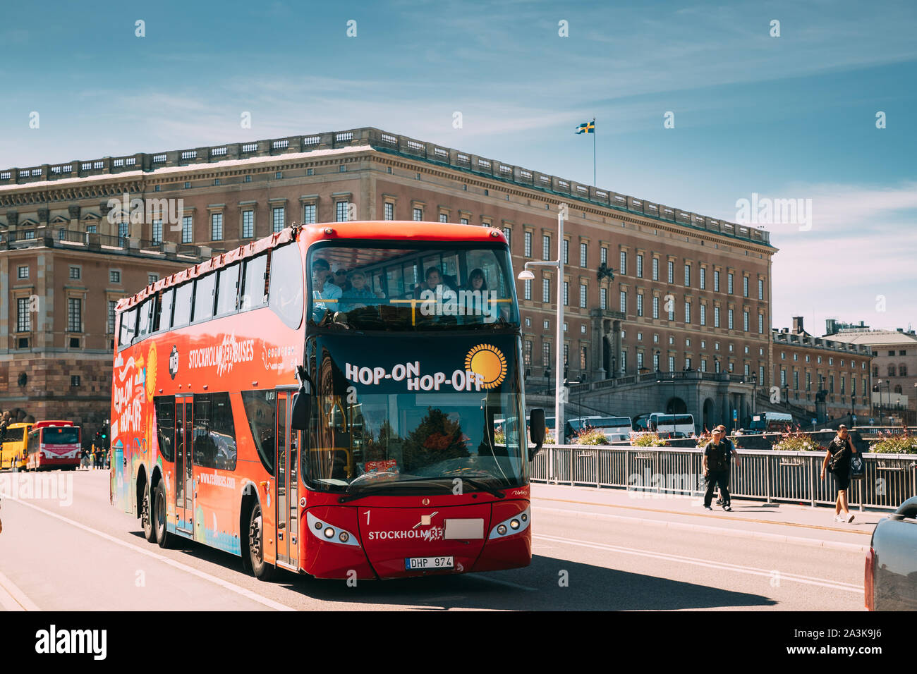 Stockholm, Sweden - June 28, 2019: Tourists Ride In Red Hop On Hop Off Bus For Down The Street Near Stockholm Royal Pala Stock - Alamy