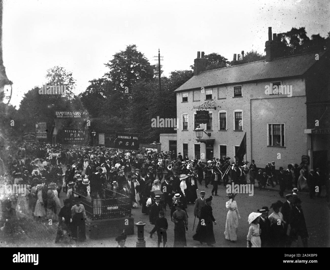Baptists and other similar groups marching past the Rose & Crown pub on the High Street in Wimbledon c1907 Photo by Tony Henshaw Archive Stock Photo
