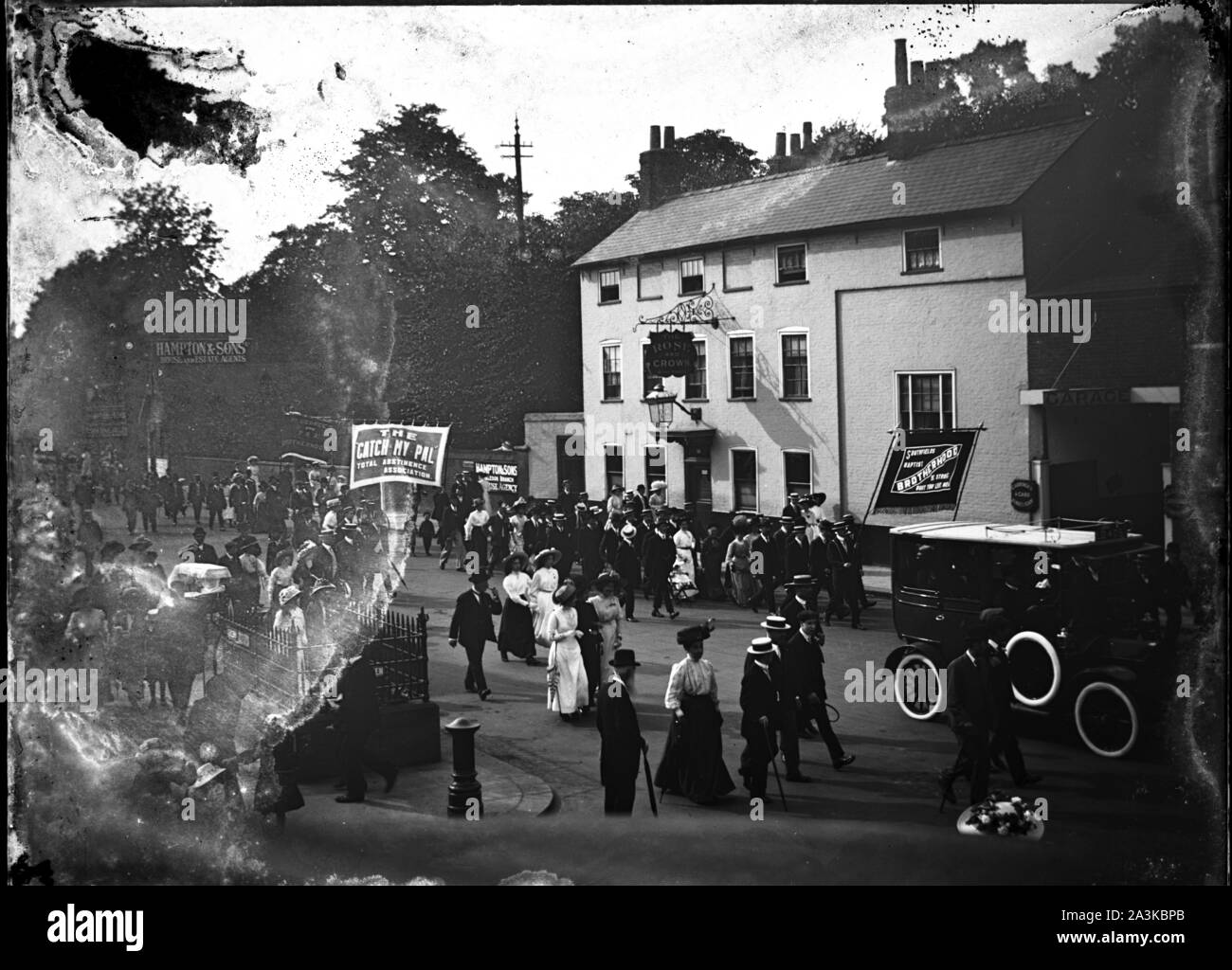 Unretouched original glass negative scan of Baptists and other similar groups including the Total Abstinence Association marching past the Rose & Crown pub on the High Street in Wimbledon c1907 Photo by Tony Henshaw Archive Stock Photo