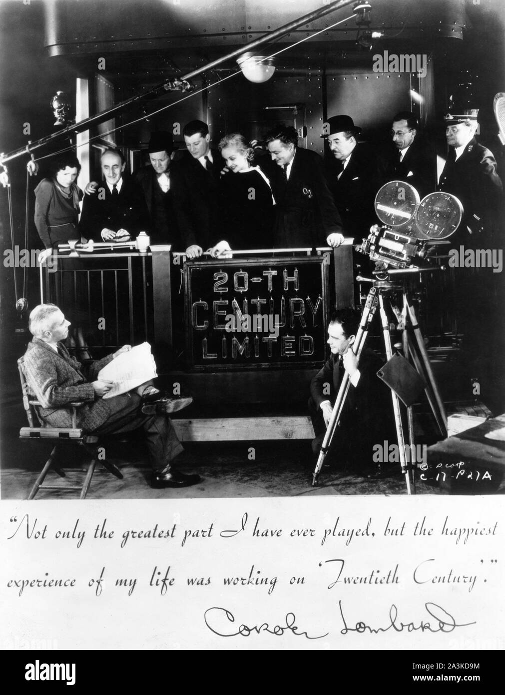 Director HOWARD HAWKS DALE FULLER ETIEN GIRARDOT ROSCOE KARNS RALPH FORBES CAROLE LOMBARD JOHN BARRYMORE WALTER CONNOLLY CHARLES LANE and JAMES P. BURTIS and cinematographer JOSEPH H. AUGUST on set candid filming TWENTIETH CENTURY 1934 screenplay BEN HECHT and CHARLES MacARTHUR Columbia Pictures Stock Photo