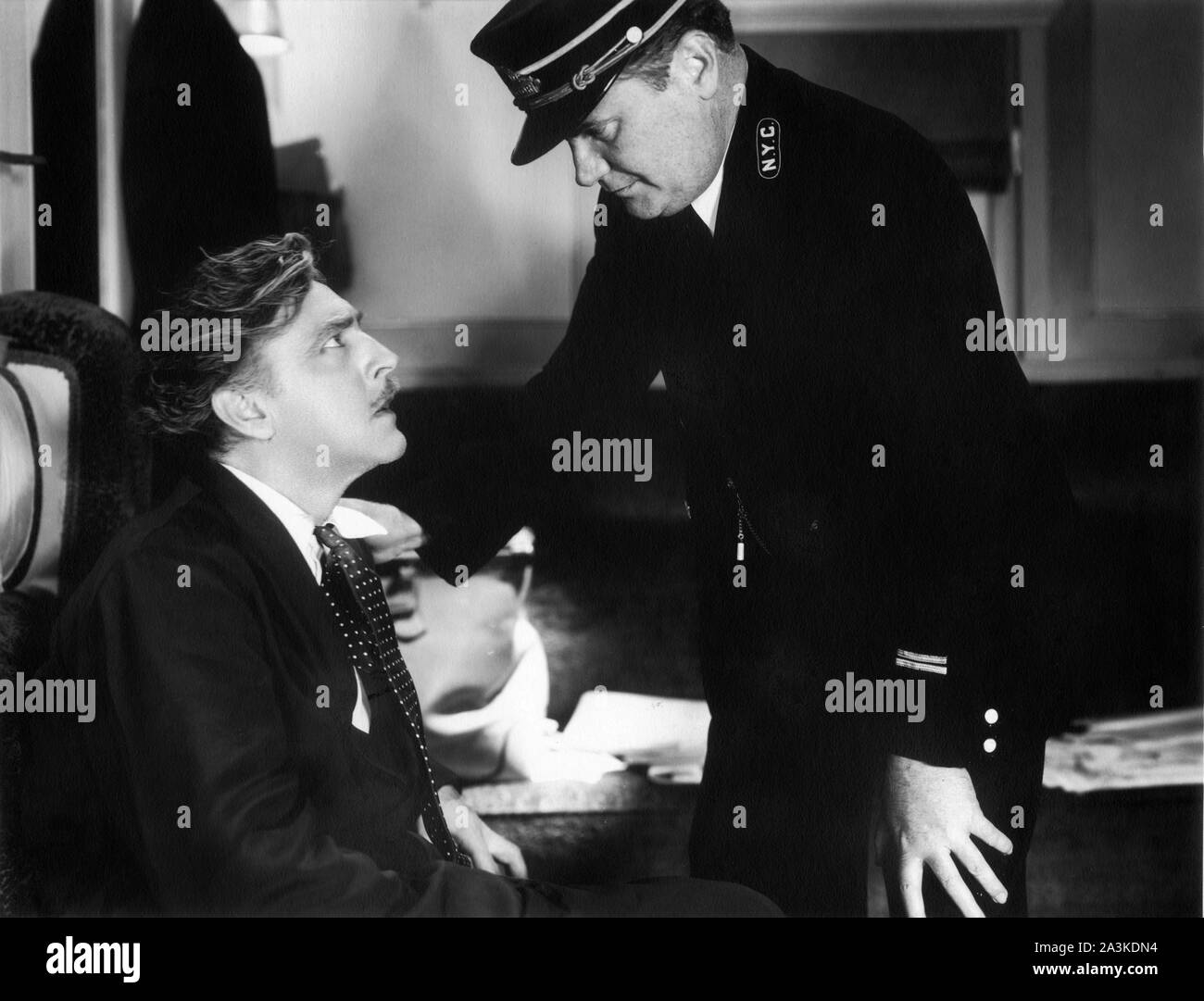 JOHN BARRYMORE as Oscar Jaffe and JAMES P. BURTIS in TWENTIETH CENTURY 1934 director HOWARD HAWKS screenplay BEN HECHT and CHARLES MacARTHUR Columbia Pictures Stock Photo